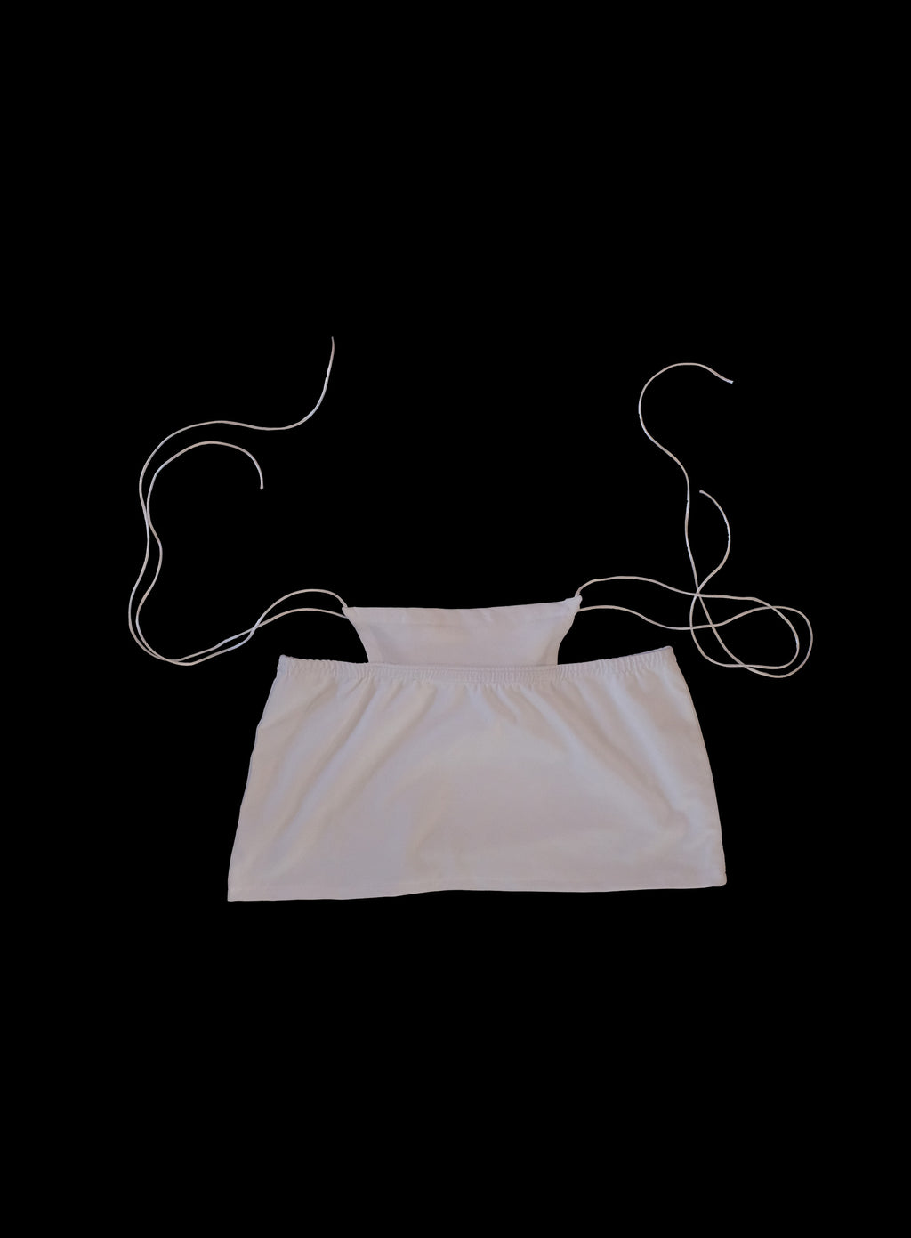 Trendy cotton jersey mini skirt with built-in whale tail feature, silky satin cords, ultra-short hemline, Y2K inspired design, handcrafted in London statement fashion