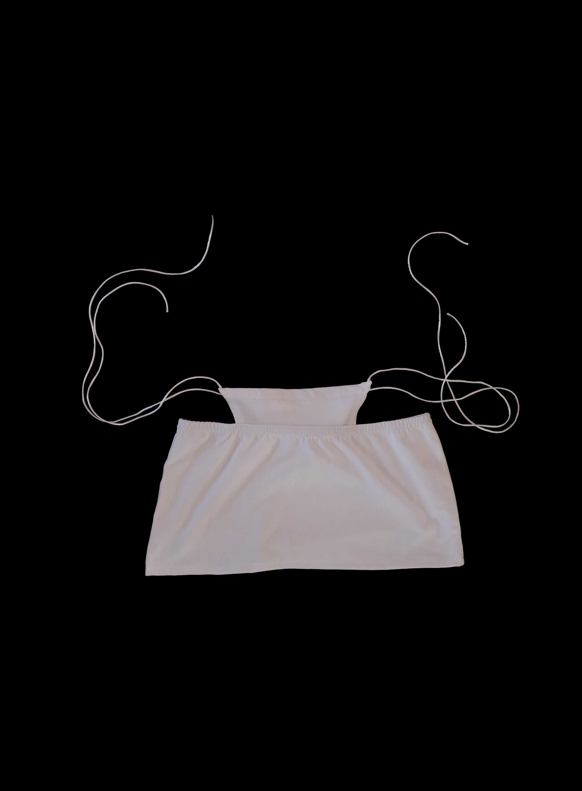 Trendy cotton jersey mini skirt with built-in whale tail feature, silky satin cords, ultra-short hemline, Y2K inspired design, handcrafted in London statement fashion
