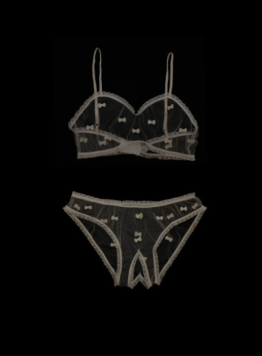 Seductive off-white crotchless lingerie set featuring low-waist knickers and bandeau bralette with miniature bows, dainty lace elastic, adjustable straps, polyester tulle handcrafted in London